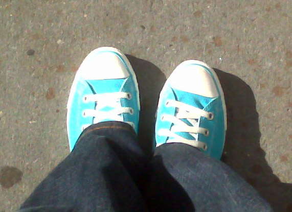 Albert wearing teal Converse shoes